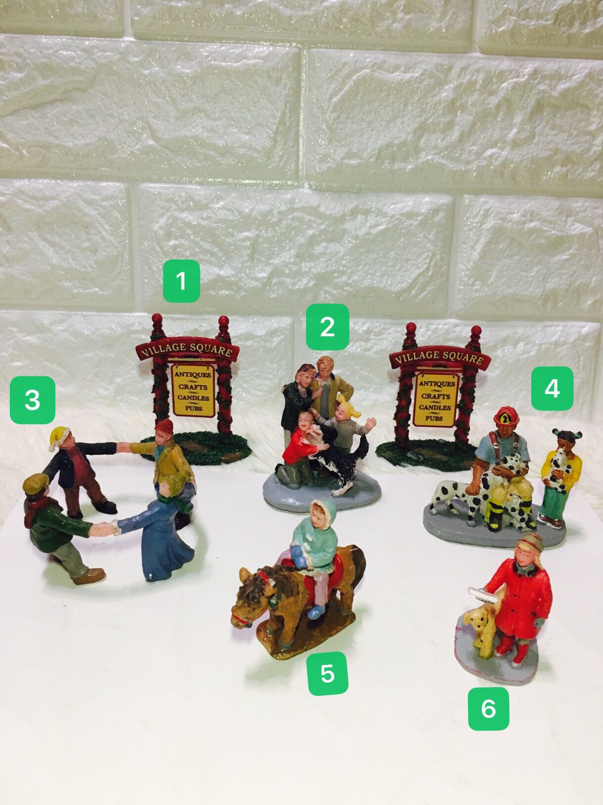 Resin warm family characters encircle hugging Dalmatians little girl riding red grass street sign instructions