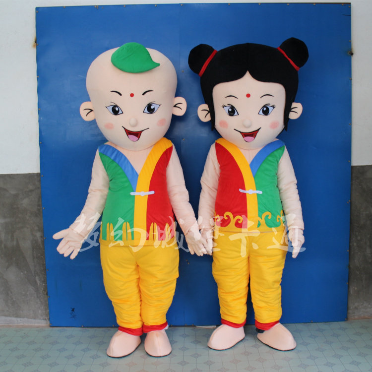 Boy mascot cartoon costume gold jade woman wears dolls walking dolls custom big dude props