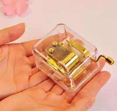 Creative gift music box Crystal music box Acrylic transparent hand-cranked cannon to send male and female couples Sky city