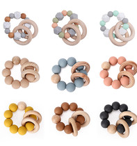 Hot selling baby beech wood chewing silicone baby teething stick diy bracelet chewing music environmentally friendly teether pacifier chain