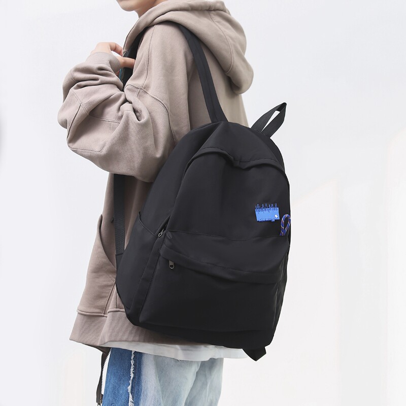 Solid color large-capacity backpack men's junior high school high school students campus simple backpack Japanese wild school bag tide