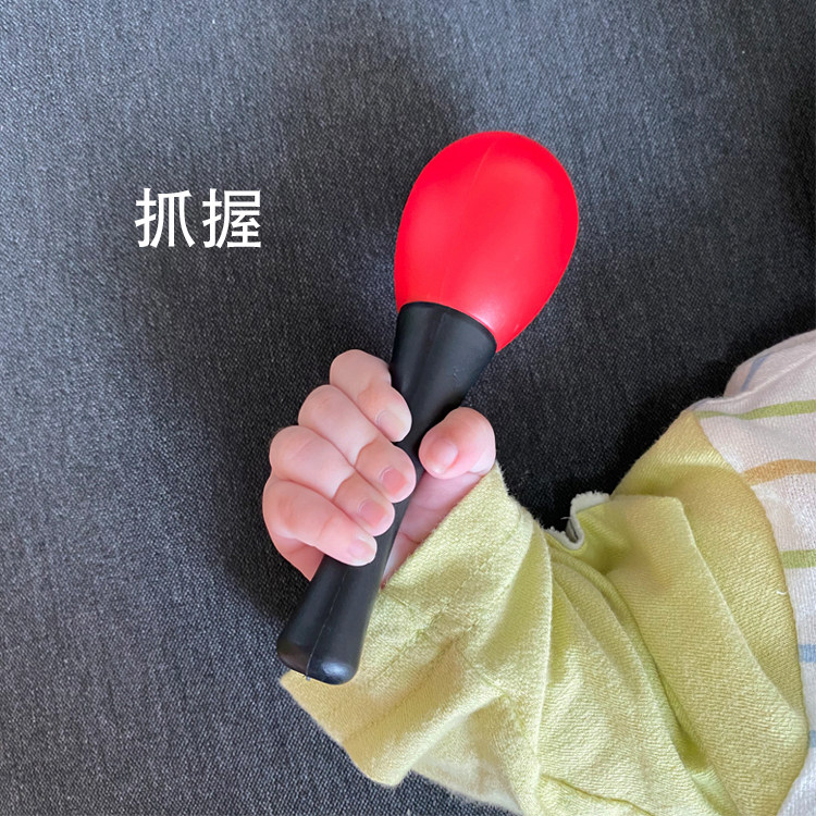 Visual chasing baby little grab training red red newborn rattle holding a rattle sand hammer small toy baby ball player listening