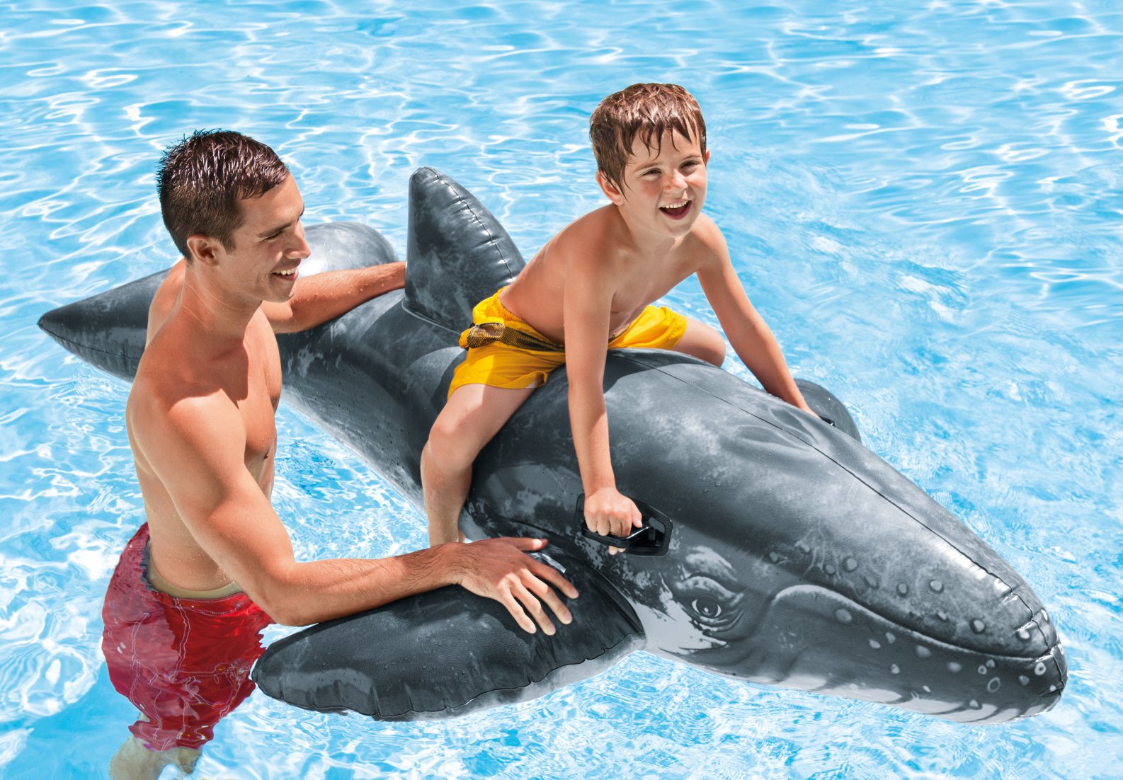 Whale sitting on water swimming pool floating Intex Realistic Whale Ride-On Pool Float