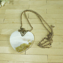 Sweater chain can be detached and used as accessories. Shells decorate hearts. Golden chain flowers. Handmade DIY flower receptacles.