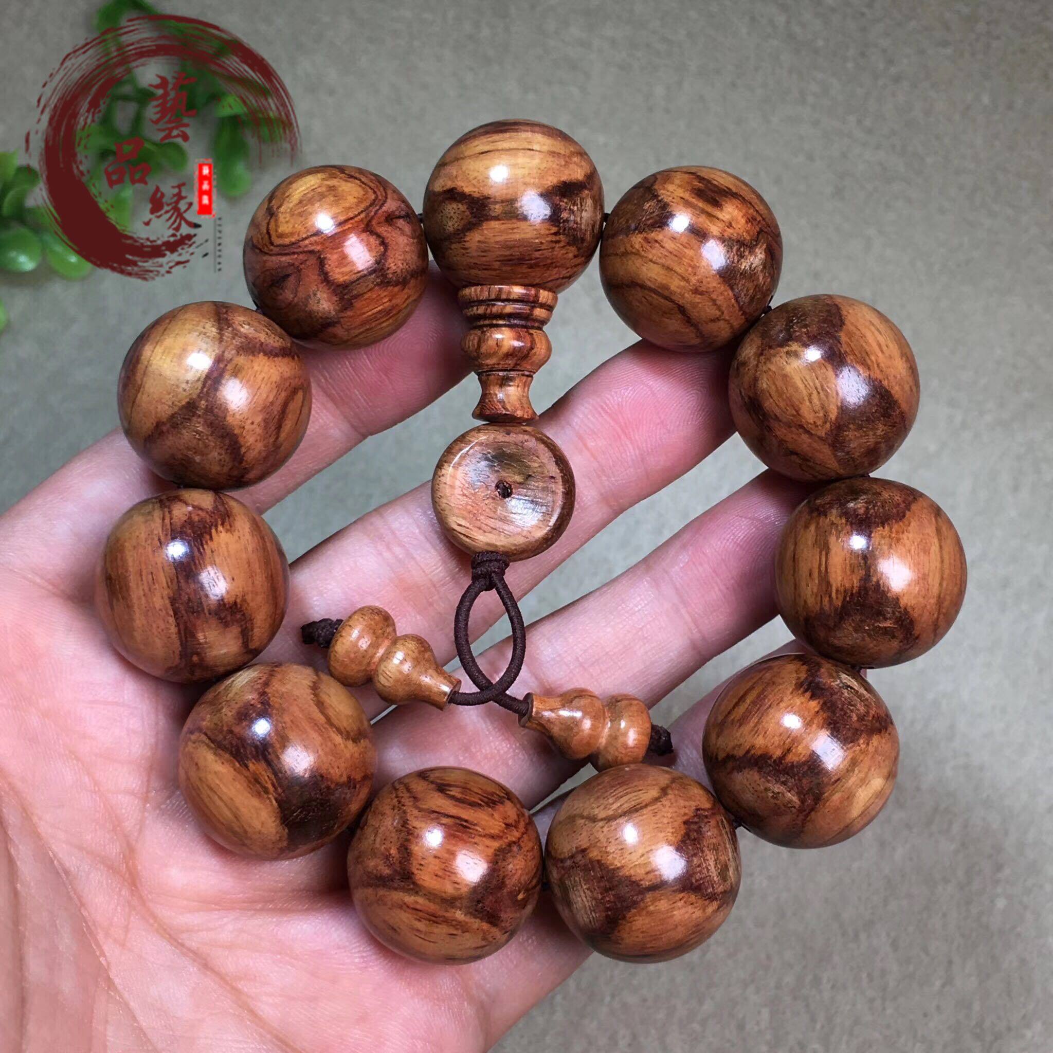 Old material ghost face huanghuali bracelet 2 0 male Hainan ghost eye pattern sea yellow cross-eye bracelet