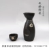 Đồ đá men màu đen với hoa anh đào trắng phong cách Nhật Bản và bình gốm bằng gốm