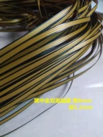 Двусторонний плоский ротанг черного и золотого цвета.