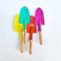 Children small children seaside beach digging sand with sand tools iron shovel Three sets of pointed shovel gardening shovel wood