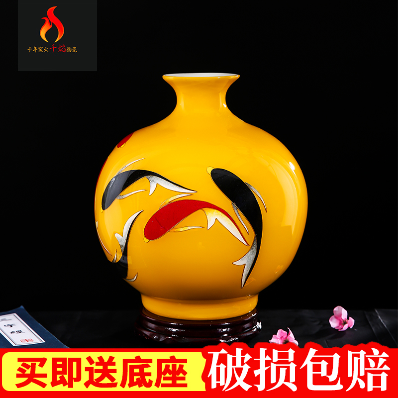 Jingdezhen ceramics high - grade yellow fish le furnishing articles figure in modern Chinese style living room decoration decoration flower arranging a gift