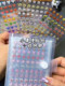 Mini sticker storage book small nose sticker pinch Le laser star sticker handbook material decoration sticker car