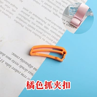 Оранжевая пряжка клипа