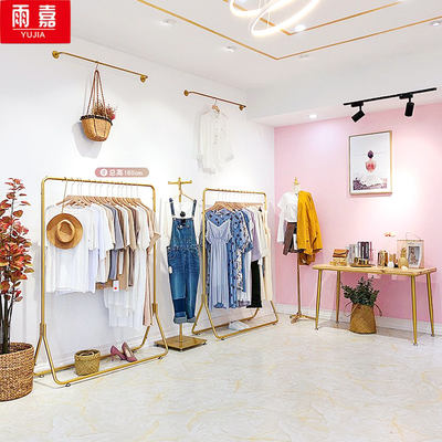 New clothing store hangers, women's clothing store display stands, golden metal shelves, hanging hangers, floor-standing clothes racks, light luxury