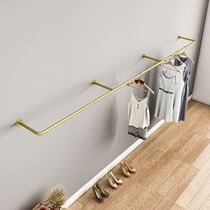 Clothing store display rack wrought iron gold hanging rod on the wall clothing rack Womens store side hanging wall hanging rack Childrens clothing rack