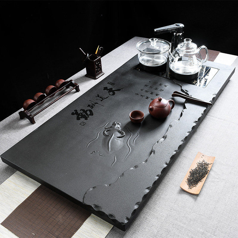 Whole black gold stone tea tray Automatic induction cooker One household stone relief buffalo Tiandaochuqin large tea table