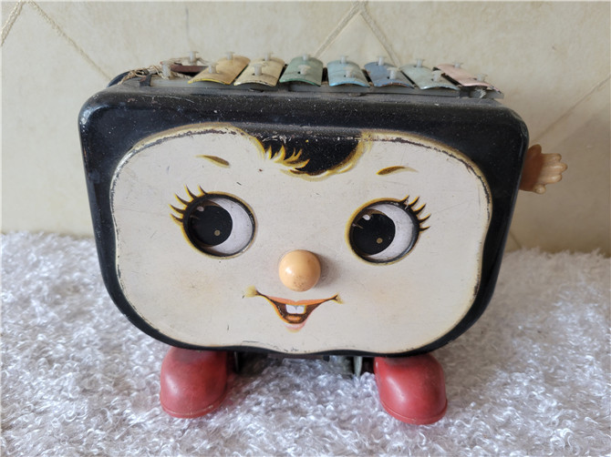 Old toy - iron toys and dolls play the piano