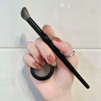 Inclined head bevelled nose and shadow brush make-up brush eye shadow brush with finger grossed brushed blush glowing and flawless brush tool