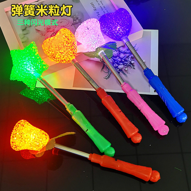 Ground-pushing luminous rice grain stick flash Firefly night market Children's toy micro-quotient suction powder sweep for small gift batch.