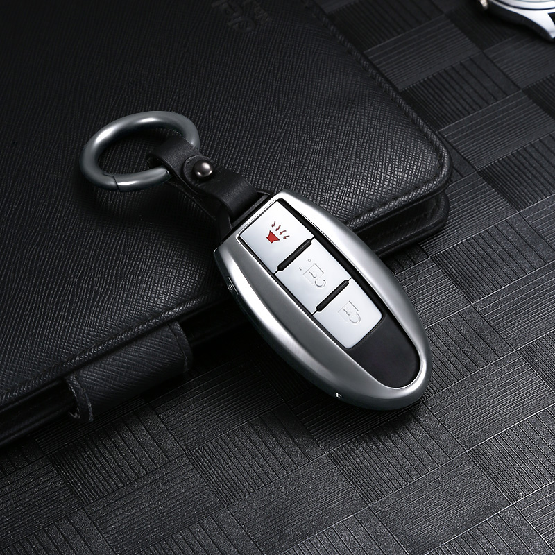 Suitable for 2020 Nissan Sylphy New Qashqai Tianlai Qijun Tiida Loulan metal car key cover bag buckle shell