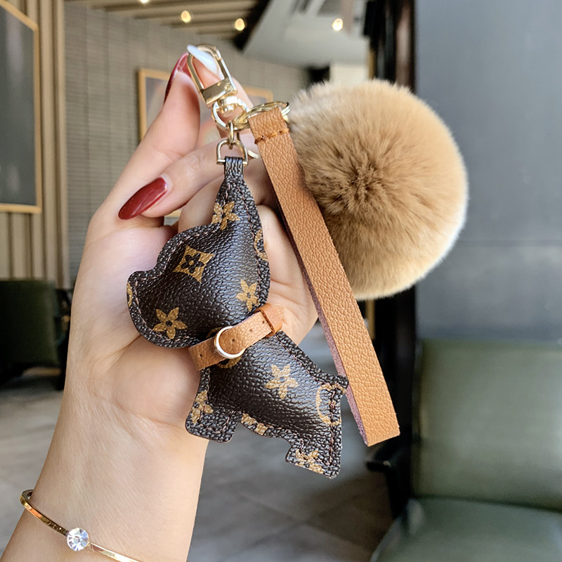 High-end creative leather puppy car keychain hanging piece original fashion cute knock keybuck female bag hanging