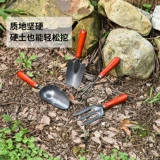 Садовые инструменты посадка цветов и цветов домохозяйственная горшка маленькая лопата на открытом воздухе на открытом воздухе.