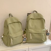 Зеленый большой кулон в виде белого медведя с разноцветной веревкой