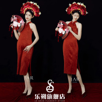 Photo studio of pregnant women with big belly and hairpins theme red cheongsam personalized retro pregnant mother indoor dress photo