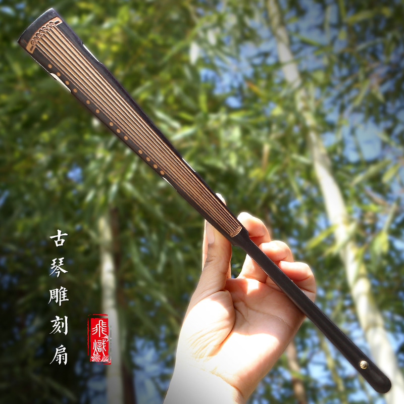 Fly incandescent with new guqin engraving fan one size black head green fan bone rice paper blank painting fan Chinese wind folding fan