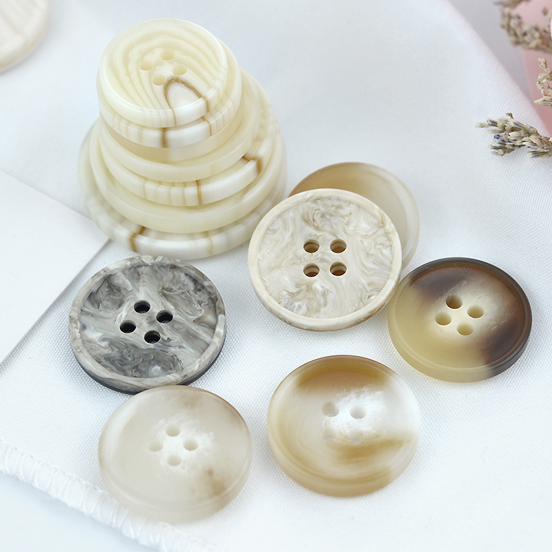 Windshirt white sweater decorated with cocktail clothes button and clothes button