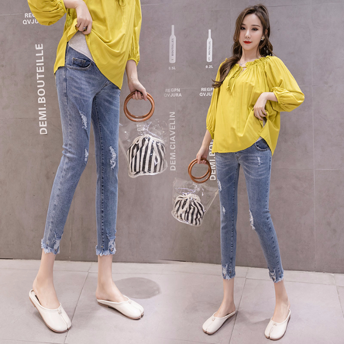 Pregnant women jeans three-point pants Tight hole smoke pipe pants fashion pencil spring and autumn women wear pregnant belly pants