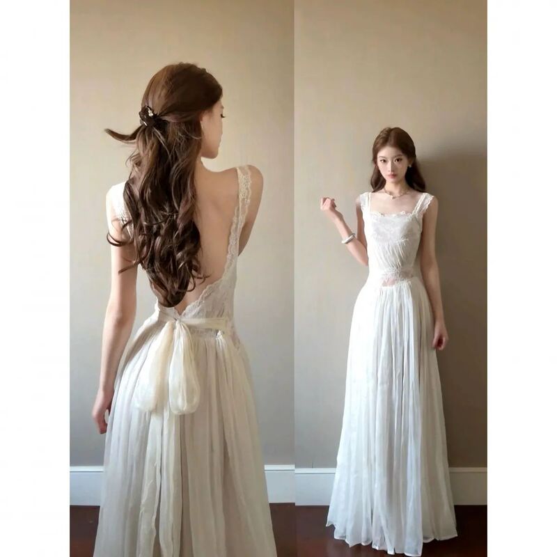 French-Style White Lace Backless Suspender Dress, Stunning Summer Vacation Style, Elegant Tie-Waist Mesh Long Dress French-Style White Lace Backless Suspender Dress, Stunning Summer Vacation Style, Elegant Tie-Waist Mesh Long Dress