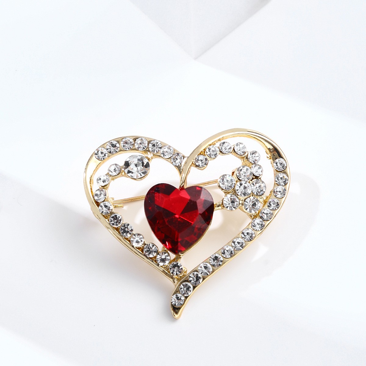 Heart-shaped brooch with diamonds, alloy pin, elegant red heart-shaped corsage, clothing accessory.