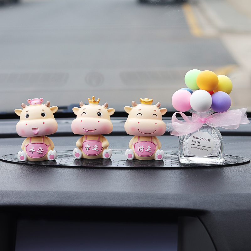 Car ornaments creative cute car cartoon shaking head Bull year doll safe center console interior decoration Encyclopedia