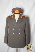 In the early days of East Germany the official horse pants the double-row button travel suit