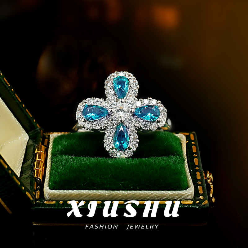 Neon Electric Blue Paraiba Blue-Green Four-Leaf Clover Ring with Water Drop Inlay and Diamond Surround, Light Luxury, Energetic Style, Colorful Gemstone Neon Electric Blue Paraiba Blue-Green Four-Leaf Clover Ring with Water Drop Inlay and Diamond Surround, Light Luxury, Energetic Style, Colorful Gemstone