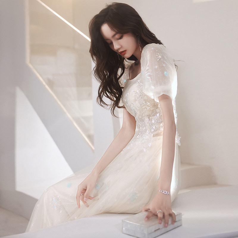 Banquet evening dress skirt female niche high-end light luxury fairy engagement host champagne color bubble sleeve temperament long version