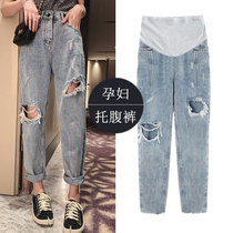 New Chinese New Year pregnant woman with small feet jeans light blue net red old daddy pants breaking hole Harun pants Damp Mother Slim 90% Totbelly Pants