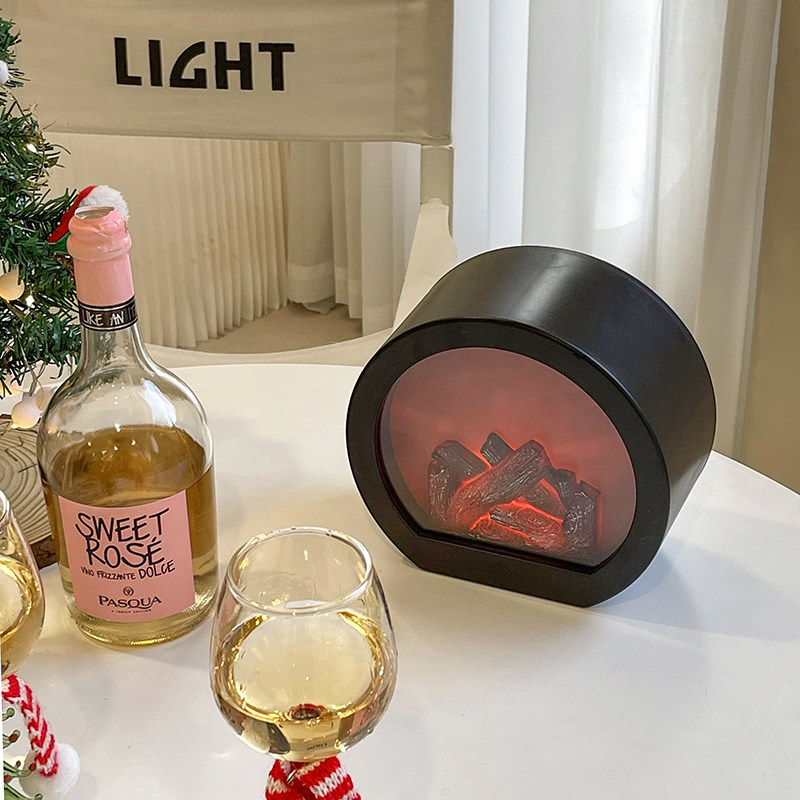In autumn and winter atmosphere lights New Year home soft-fitted café home flame lights burning fireplace