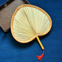 Traditional piece of leaf brown leaf wrapping a large bushel hand fan hand fan retro nostalgia old objects natural fan face asymmetry