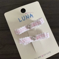 Розовый клетчатый двухслойный узел-сверло.