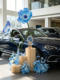 4S Store Car Delivery Ceremony Decoration with Blue Artificial Flowers, Fake Flower Arrangements, Flower Path Decorations, and Ambiance Scene Setup