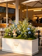 Trendy Restaurant Ambiance Scene Setup with Artificial Greenery, Flower Box Decorations, and Artificial Flower Arrangements