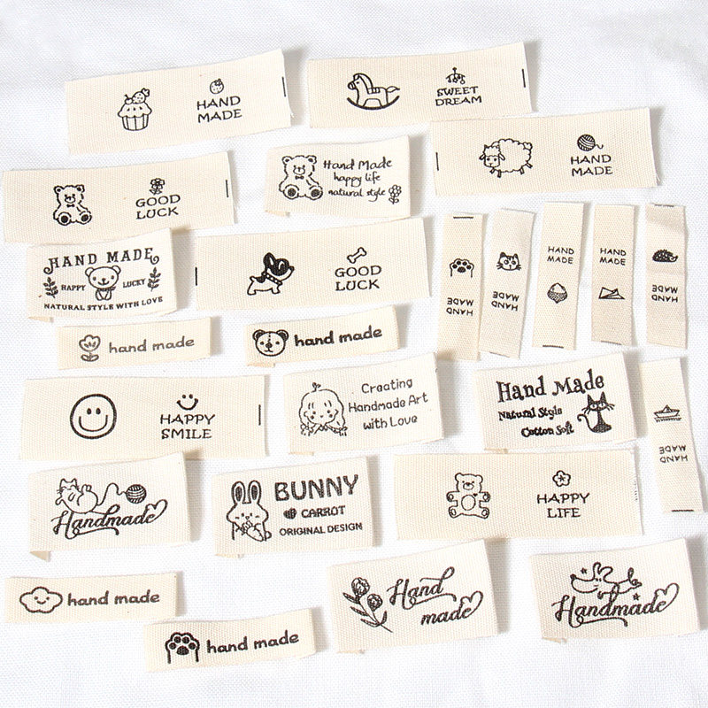 織りラベル、布製タグ、布製ラベル、手編み・かぎ針編みの布製工芸品、人形用ラベル、バッグや帽子のラベル、DIY工芸品。