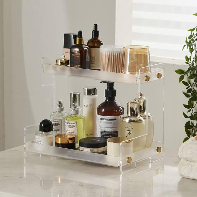 ເຄື່ອງສໍາອາງ acrylic ແລະຜະລິດຕະພັນການດູແລຜິວຫນັງເກັບຮັກສາ rack cup storage rack perfume aromatherapy dressing table display rack bathroom