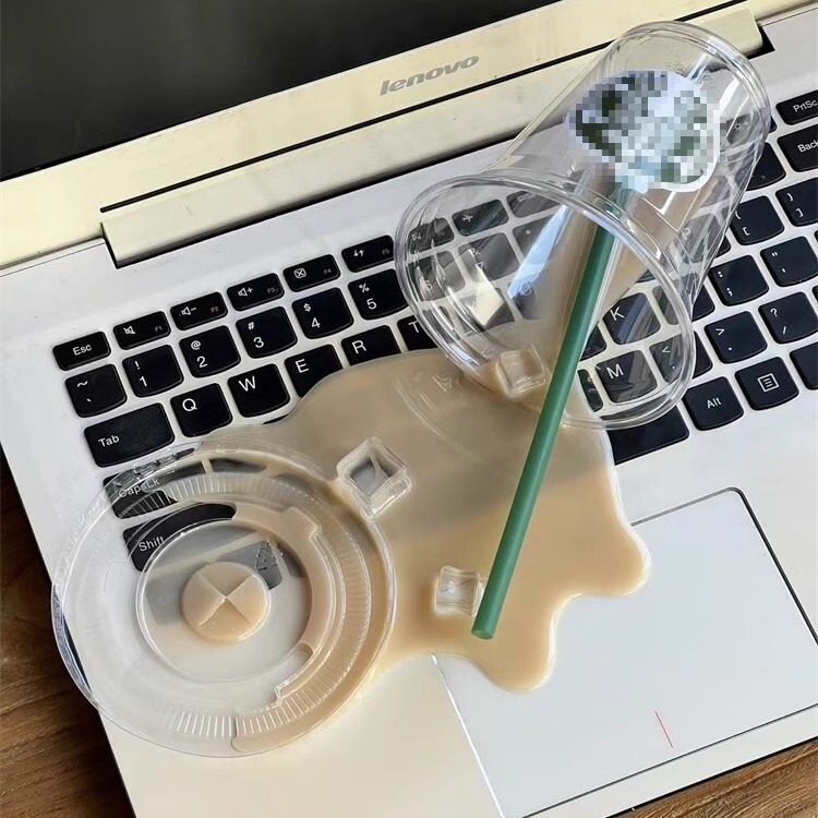 Spilled Coffee Spilled on a Funny, Scary, and Quirky Desktop Decoration Toy, a Funny Gift, and a Phone Stand