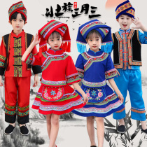 South Chinas Guangxi Zhuang Autonomous Region March Three childrens ethnic minorities cast their clothes for the girls boy Yi Miao dance performance clothing