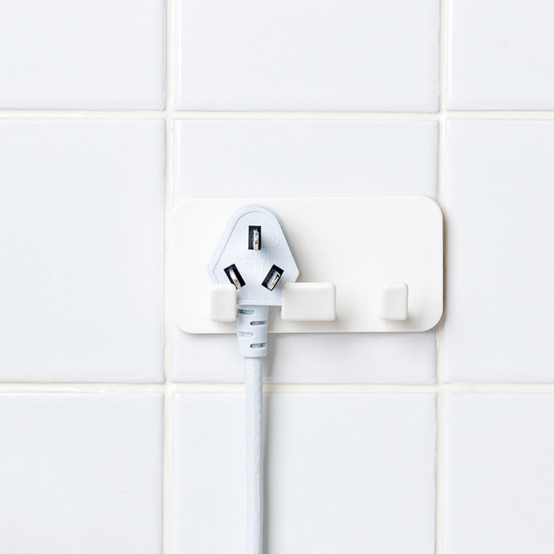 No trace power plug holder kitchen powder room punch-free bracket paste wall hook storage mobile phone holder