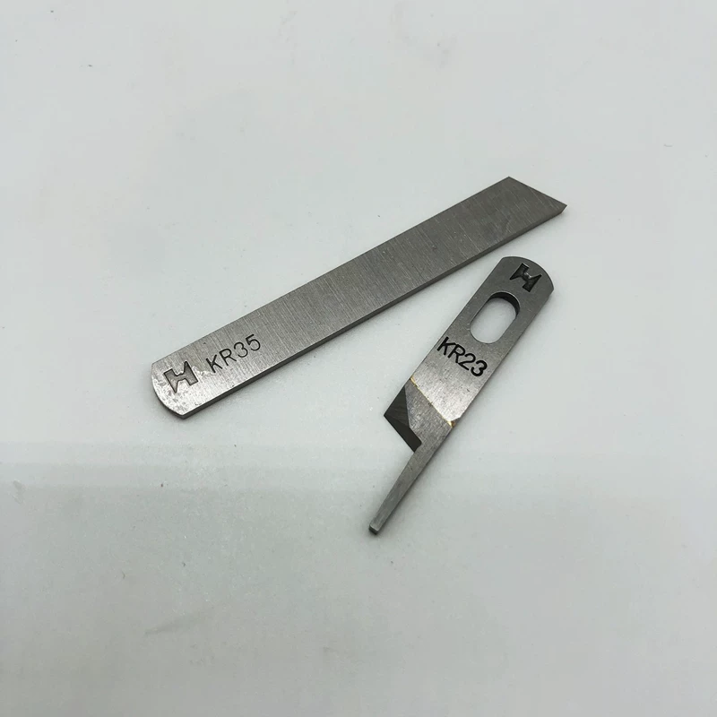 Qiangxin thương hiệu máy vắt sổ lưỡi dao áo khoác máy lưỡi bạc Mũi tên 747 máy vắt sổ trên và dưới cắt KR23 KR35