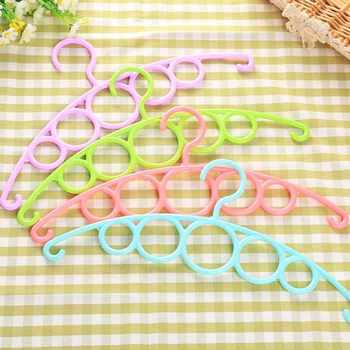 Creative multi-functional multi-portion towel storage rack full material belt new collar ribbon hanging clothes drying rack