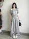 Korean age-reducing casual sportswear suit for women in summer, simple waistline, one-line shoulder, slanted shoulder, short-sleeved skirt, two-piece set
