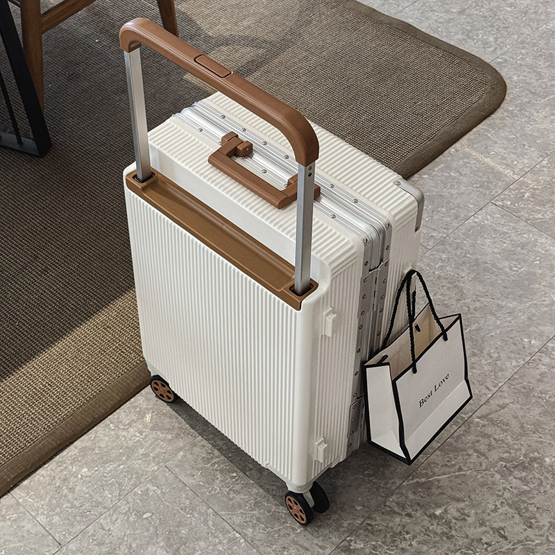 Women's wide-wheeled aluminum-framed carry-on suitcase with universal wheels, quiet operation, large capacity, and combination lock.